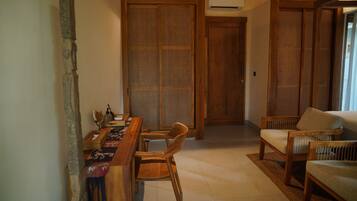 A traditional room with a wooden table, chairs, and a sliding door.