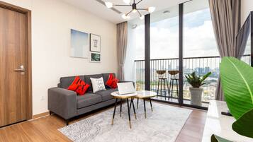 Premium Apartment, 3 Bedrooms, Balcony, City View | Living room | 42-inch Smart TV with satellite channels, pay films