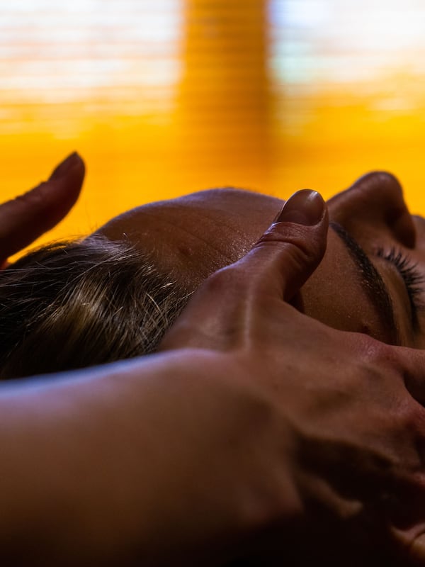 Guests can unwind with a soothing massage or relaxation technique on a comfortable surface.