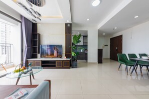 Family Triple Room | Living area - RIVERGATE apartment infinity pool & Gym  (Ho Chi Minh City)