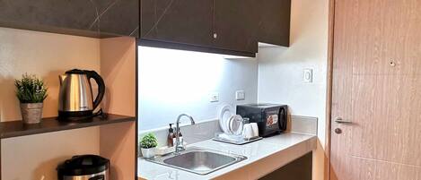 Fridge, microwave, electric kettle, high chair