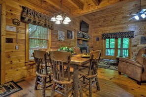 Dining - Welcome to Relaxing River Retreat, where your pets are welcome amidst a scenic riverfront, screened porch, hot tub, WiFi, firepit, and abundant wildlife (Ellijay)