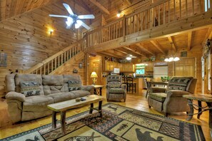 TV, fireplace - Welcome to Relaxing River Retreat, where your pets are welcome amidst a scenic riverfront, screened porch, hot tub, WiFi, firepit, and abundant wildlife (Ellijay)