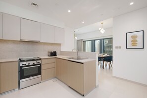 Deluxe Apartment, 2 Bedrooms | Private kitchen | Fridge, microwave, oven, dishwasher