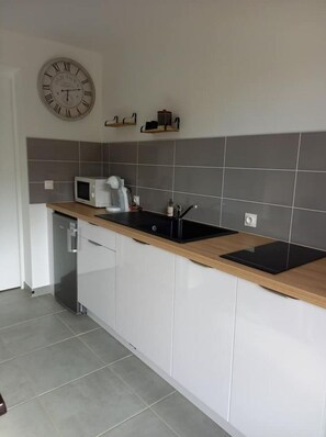 Fridge, microwave, stovetop, coffee/tea maker