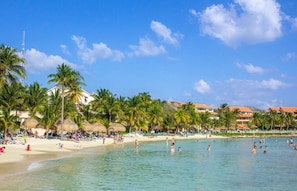 Guests can enjoy a beachside stay with access to the sandy beach and calm sea.
