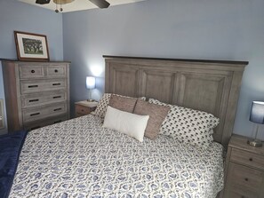 A bedroom with a bed, dresser, nightstand, lamp, and a framed picture on the wall. - 4314 Mountain View Suite w/Pool, hot tub & more (Beech Mountain)
