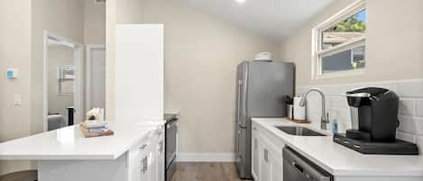 Coffee/tea maker, fridge, microwave, oven
