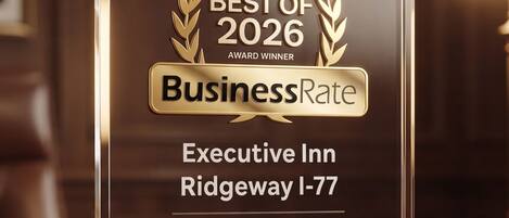 Una placa de reconocimiento clara para Executive Inn, Ridgeway I-77, Hotel, Condado de Fairfield, Carolina del Sur, habilitada por Google Reviews, y etiquetada como Benchmark.