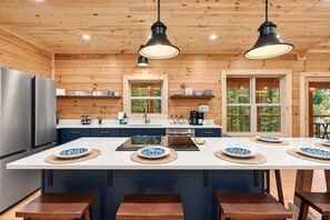 Fill the big fridge with food for the week. The oven, dishwasher, and deep sink cover home-cooked meals from start to finish.
