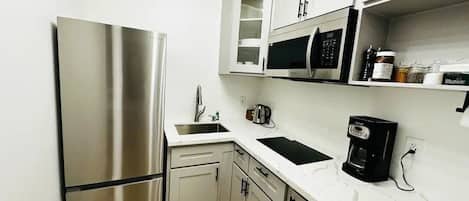 Fridge, microwave, stovetop, coffee/tea maker
