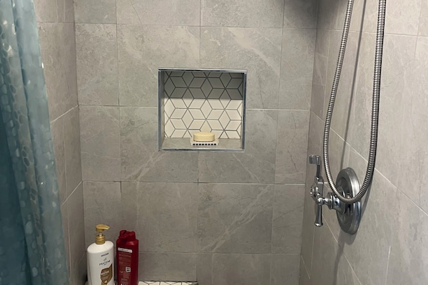 Shower, hair dryer, towels, soap