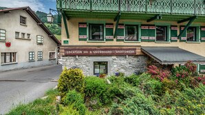 A building with a sign indicating it is a location for ski and snowboard sportswear.