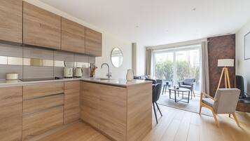 Apartment | Private kitchen | Fridge, oven, stovetop, dishwasher