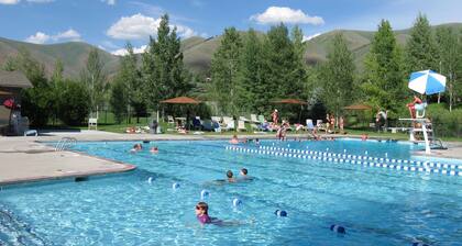 Ski bus stops at front door, court sports and indoor game room, bike path