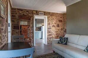 House, 1 King Bed, Patio (524 Austin St- Guest) | Living area | 40-inch TV with digital channels