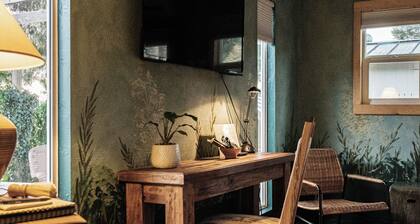 A boutique-hotel-style suite with a private entrance, tucked into our wild garden landscape.