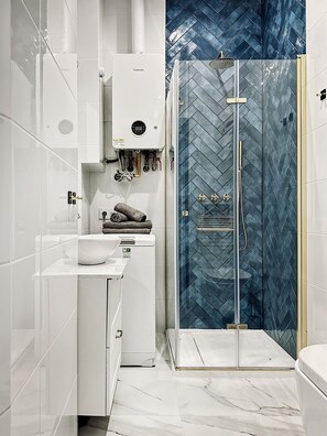 Shower, hair dryer, towels, soap