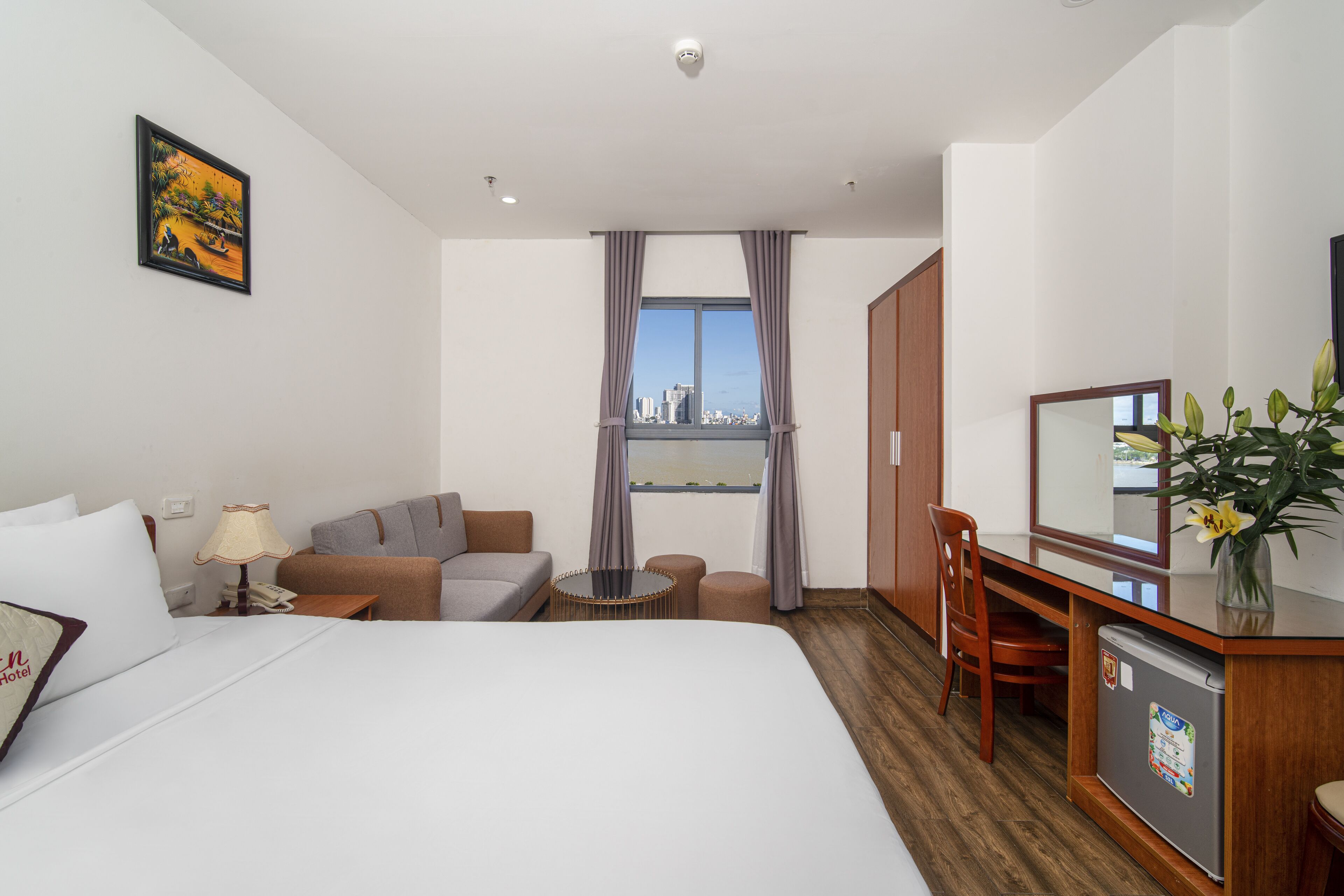 Deluxe Double Room, River View | Premium bedding, minibar, individually decorated, desk