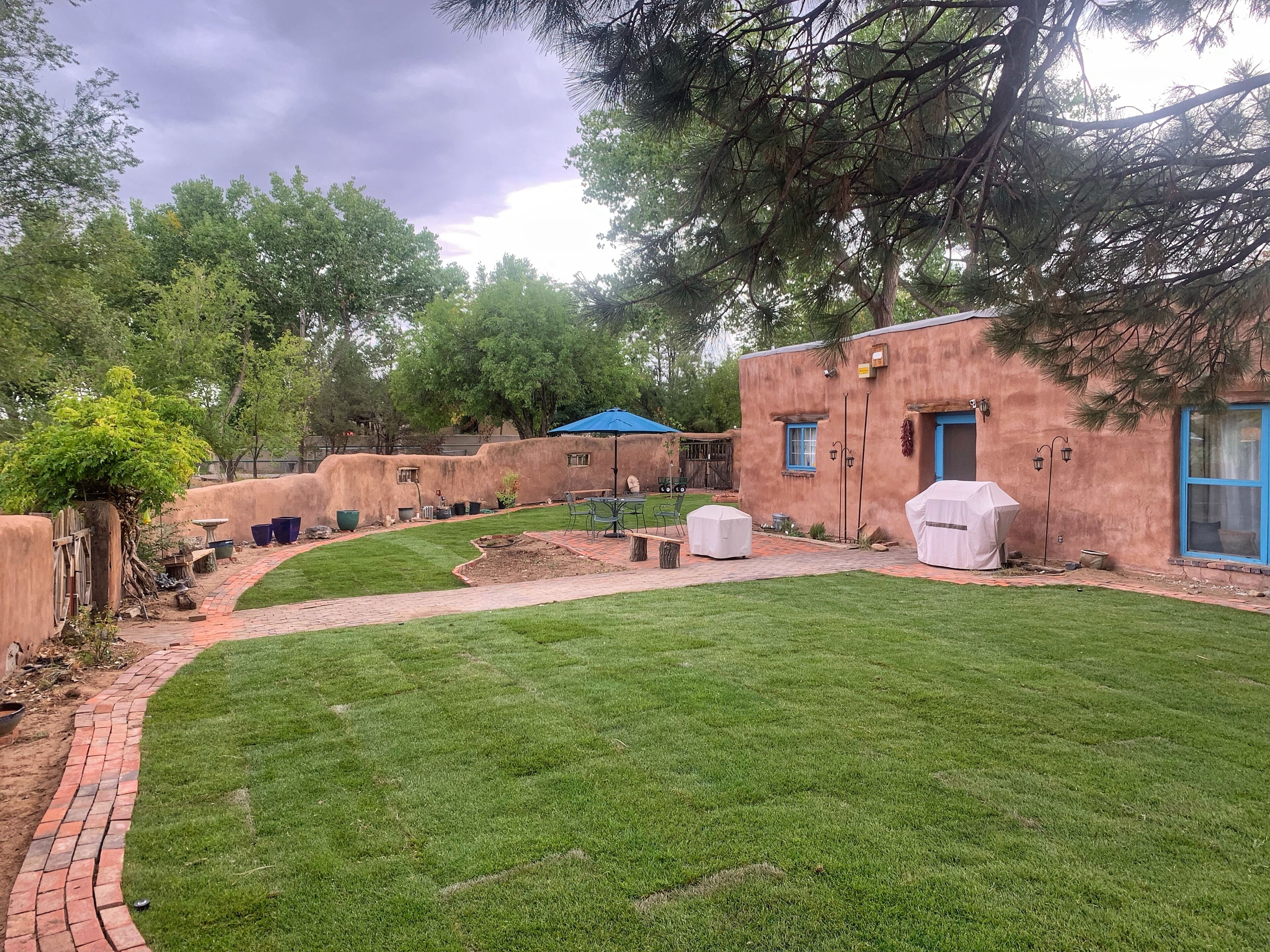 Peaceful artisan adobe with view of the Sandias