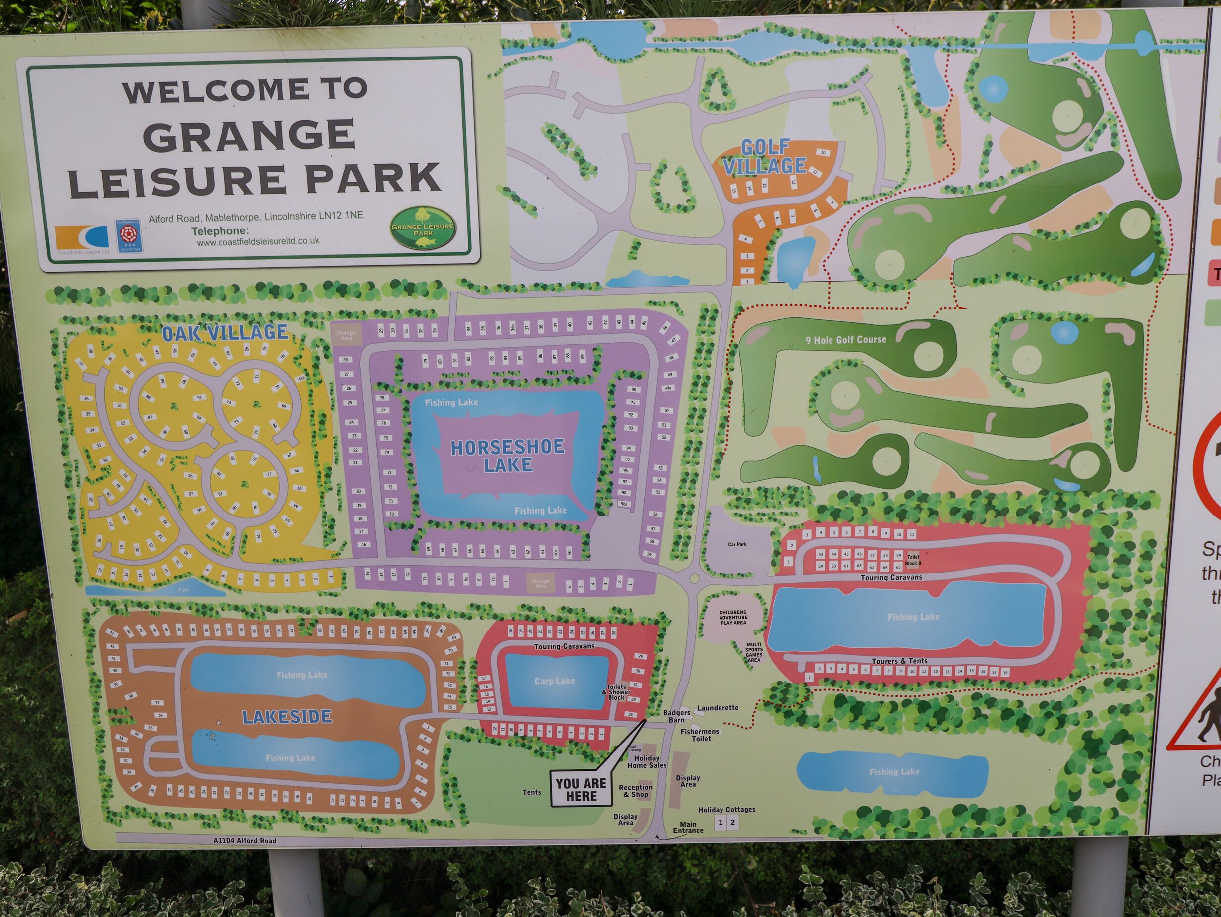 A map of Grange Leisure Park with marked areas like Oak Village, Horseshoe Lake, and a 9-hole golf course.