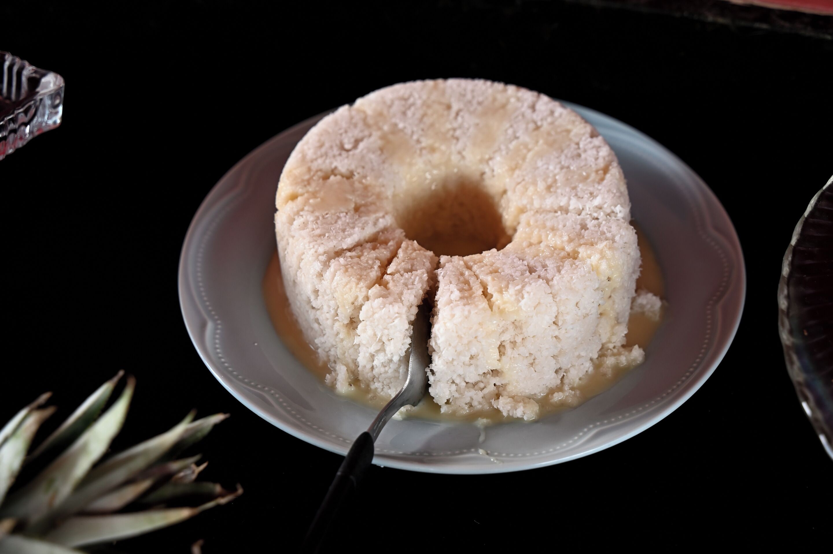 A cake on a plate with a fork.