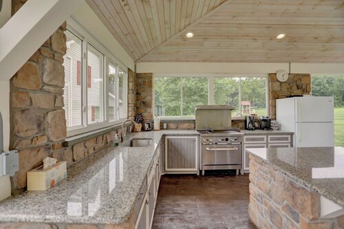 A luxury farm stay with something special for everyone in your group! Volleyball, baseball, pickleball, outdoor kitchen with pavilion, a private pond and dock for swimming, and so much more!