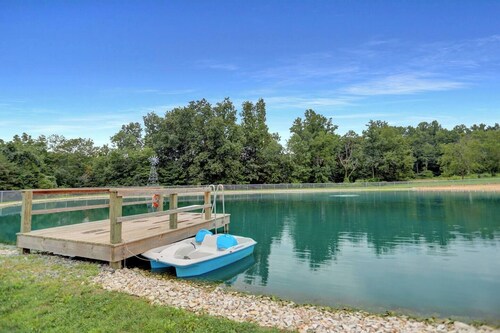 A luxury farm stay with something special for everyone in your group! Volleyball, baseball, pickleball, outdoor kitchen with pavilion, a private pond and dock for swimming, and so much more!