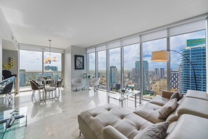 Luxury Apartment, 2 Bedrooms, City View | Living area | 50-inch Smart TV with cable channels
