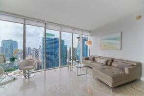 Luxury Apartment, 2 Bedrooms, City View | Living area | 50-inch Smart TV with cable channels