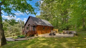 A log cabin with a deck, outdoor seating, and a fire pit. - Unplug from the daily grind, whether a fun family getaway or a retreat with friends, this cabin is a perfect refuge to unwind and rejuvenate. Brand new Hot Tub! (Elliottsburg)