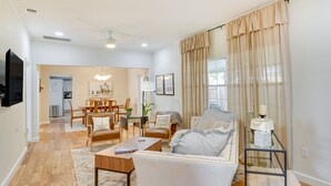 A spacious living room with a sofa, armchairs, a coffee table, and a dining area in the background. - Lake Wales Vacation Rental w/ Screened-In Porch! (Lake Wales)