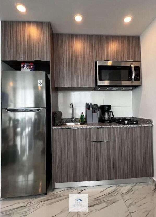 Fridge, microwave, stovetop, coffee/tea maker