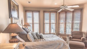 A bedroom with a bed, a chair, a lamp, a dresser, and a ceiling fan. - LOCATION! 100ft from PRIVATE beach access (Santa Rosa Beach)