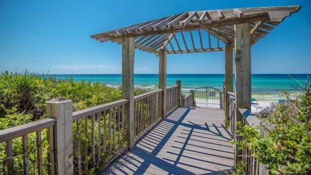 A wooden boardwalk leading to a beach with a wooden pergola structure. - LOCATION! 100ft from PRIVATE beach access (Santa Rosa Beach)