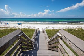 A wooden boardwalk leading to a beach with white sand and clear turquoise water. - Deeded Beach Access and Community Pool (Santa Rosa Beach)