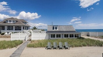 Cottage,beach and courtyard view from ocean. 