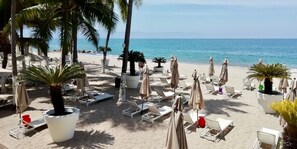 On the beach, sun-loungers, beach towels