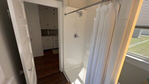 Shower, hair dryer, towels, toilet paper