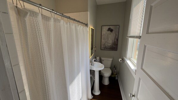 Shower, hair dryer, towels, toilet paper