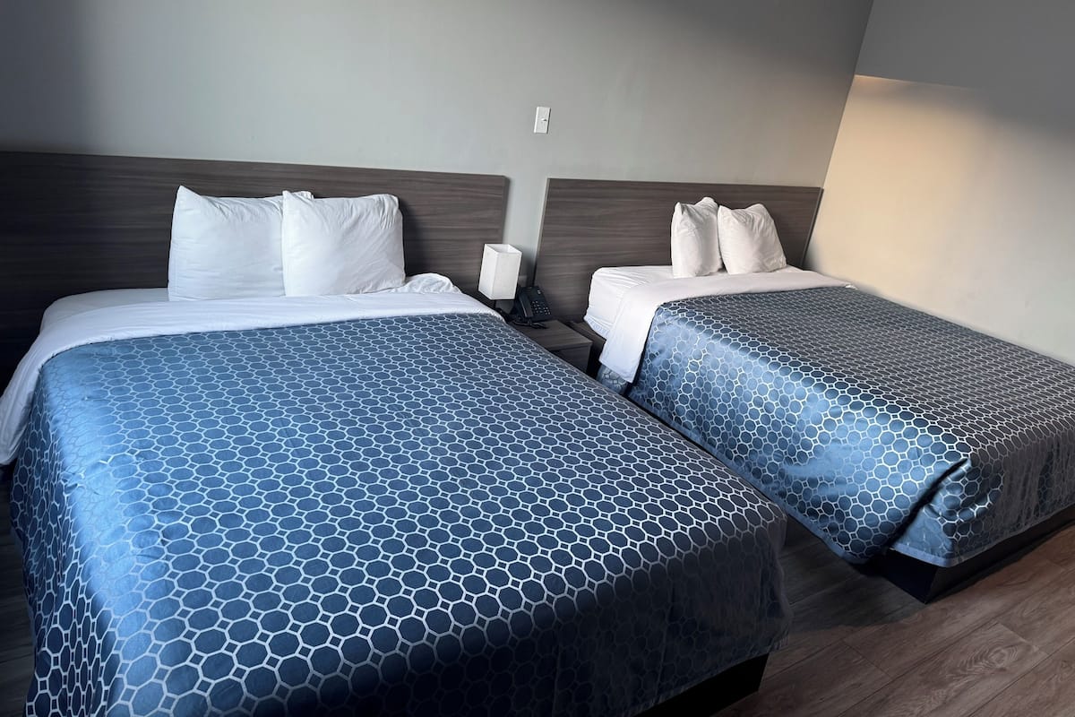 Basic Room, 2 Double Beds, Non Smoking | Living area | 42-inch flat-screen TV with satellite channels, table tennis
