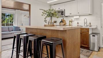 Fridge, microwave, stovetop, coffee/tea maker