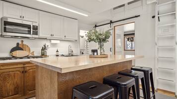 Fridge, microwave, stovetop, coffee/tea maker