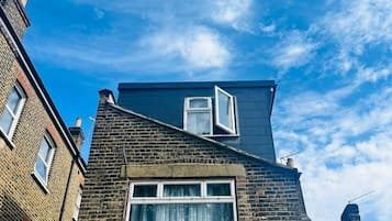 Family Triple Room, Shared Bathroom | Memory foam beds, individually decorated, individually furnished, desk