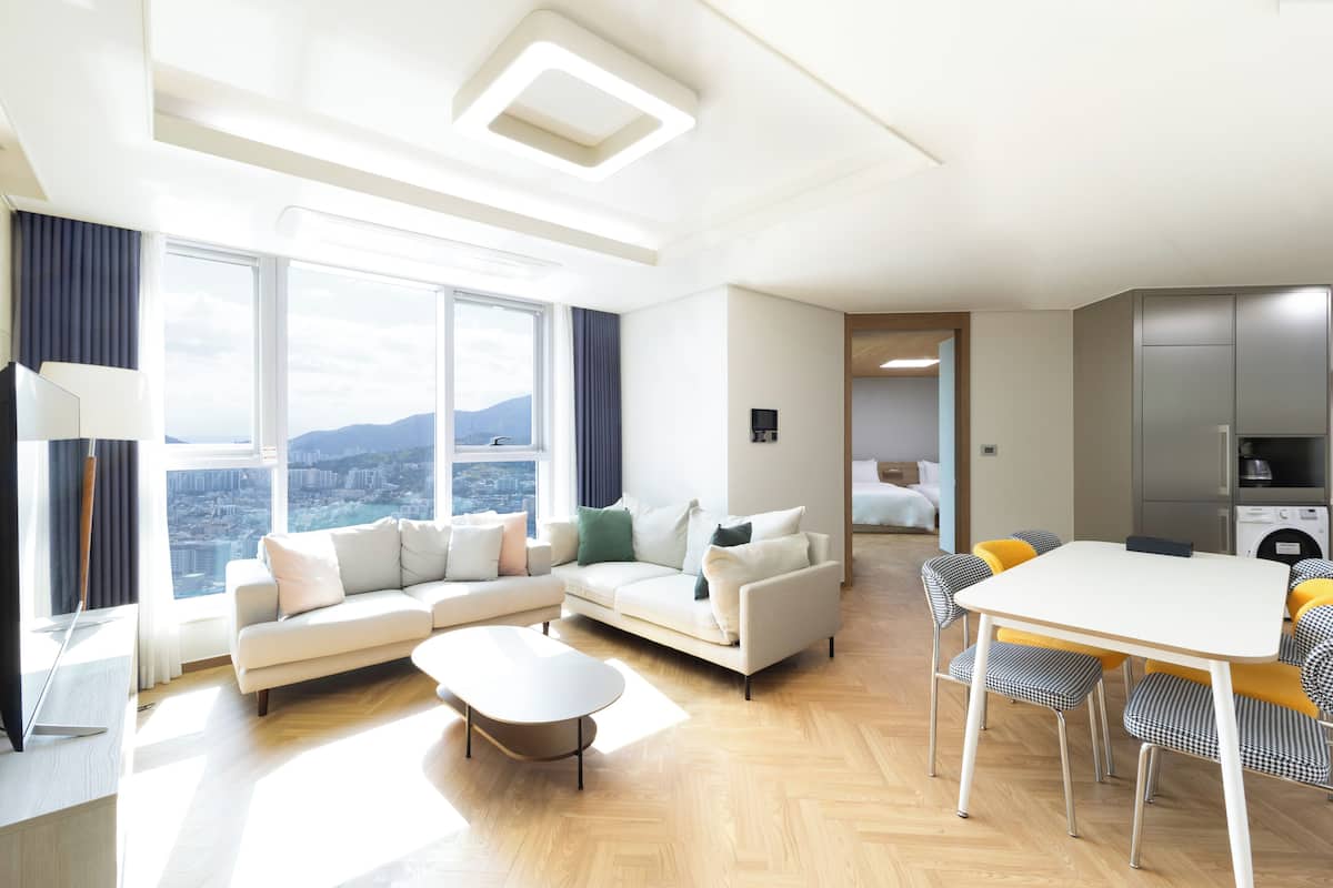 Connecting Suite Seven Bed | Living area | 65-inch Smart TV with cable channels, Netflix, pay films