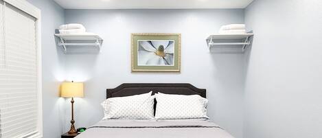 1 bedroom, desk, iron/ironing board, travel crib