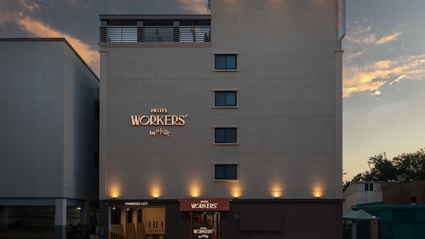 A modern hotel building with a sign reading "Hotel Workers". - Workers Hotel Ansan by Anook (Ansan)