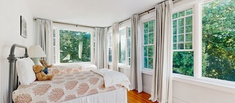 Historic home steps from the harbor with enclosed porches & gorgeous deck