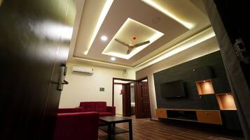 Premium Suite | Living area | 43-inch Smart TV with premium TV channels, Netflix, pay films