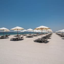 Private beach, white sand, sun loungers, beach umbrellas